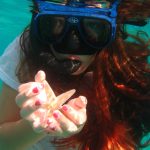 Katie holding star at Little bay tortola