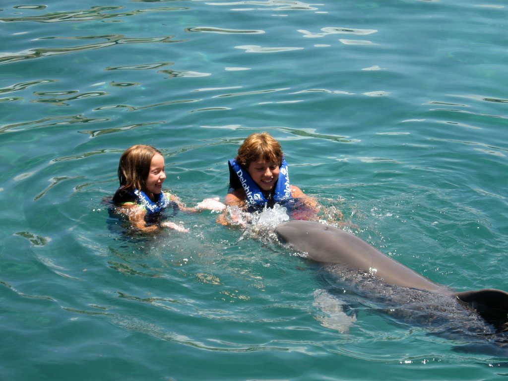 Playing with dolphins at Xcaret Park